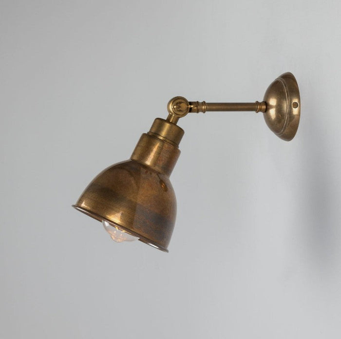 Baku Moorlea Brass Adjustable Wall Light with vintage aged finish and flexible arm for focused lighting