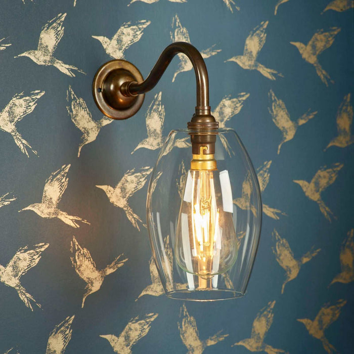Camber Small Clear Glass Shade Wall Light with elongated clear glass shade and metal fixture