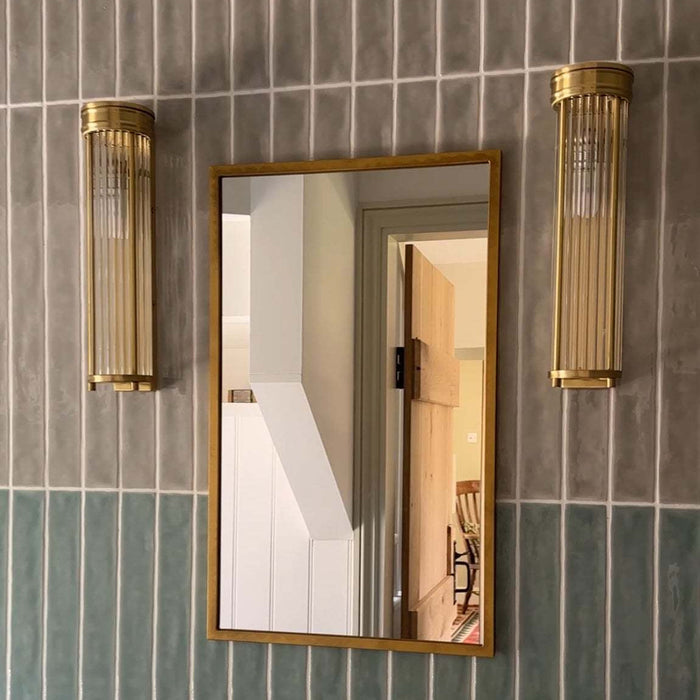 Chester Glass Rodded Bathroom Wall Light in satin brass with moisture-resistant design and ambient illumination