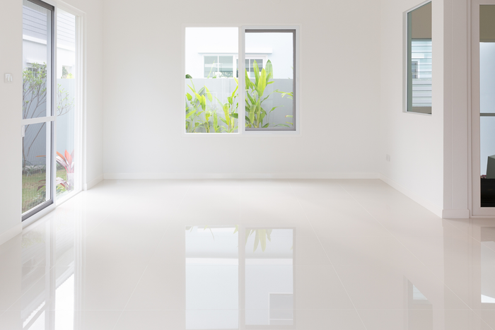 Modern room with large windows and a white interior