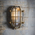 Devonport Bulkhead Wall Light vintage outdoor brass wall light with ribbed glass and warm glow
