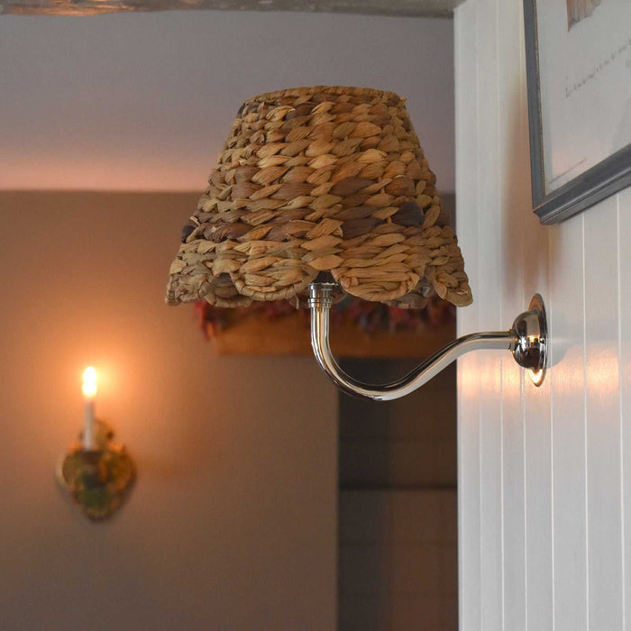 Natural seagrass shade bathroom wall light with warm, elegant handcrafted design