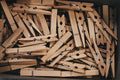 Box filled with natural wooden clothespins with metal springs