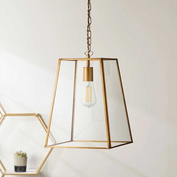 Large Luxor Lantern Pendant light with clear glass and antique brass frame for elegant home décor
