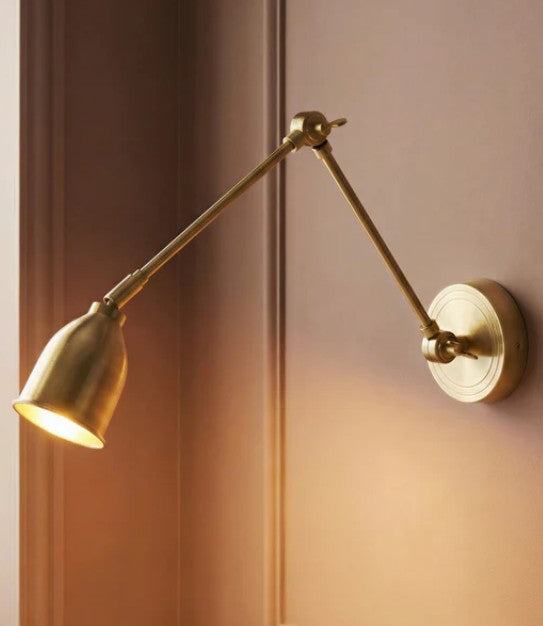 Pooky Pick Brass Wall Light with adjustable arm and solid brass finish for versatile interior lighting