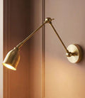 Pooky Pick Brass Wall Light with adjustable arm and solid brass finish for versatile interior lighting