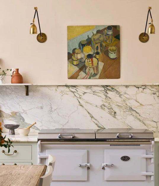 Pooky Pick Brass Wall Light with adjustable arm and warm brass finish mounted on wall