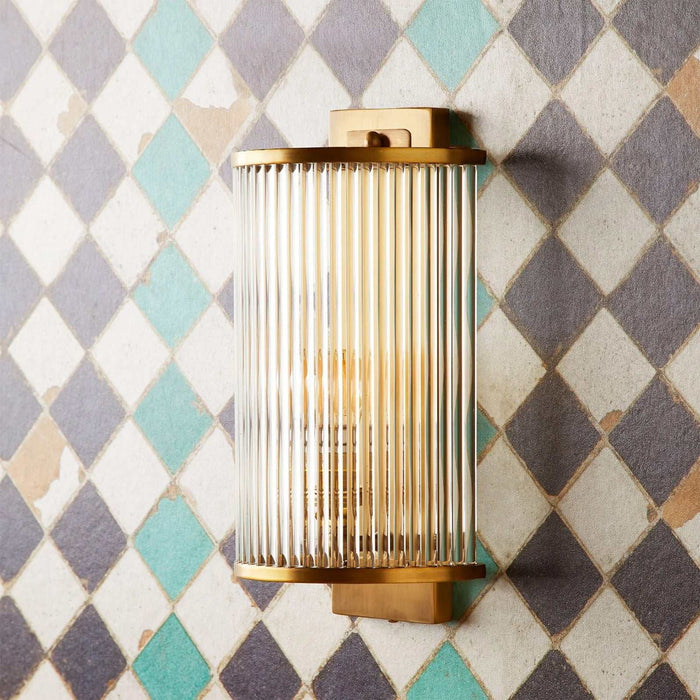 Pooky Roddy Wall Light with 20 clear glass rods in semi-circular Art Deco design, available in Nickel or Brass finishes.