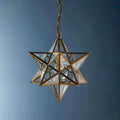 Pooky Stella Star Pendant Light medium clear glass star-shaped ceiling light with faceted design and brasswork details