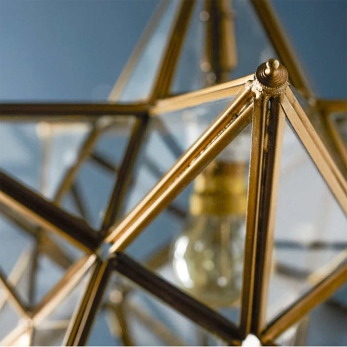 Medium Pooky Stella Star Pendant Light with clear faceted glass and brasswork design hanging from ceiling