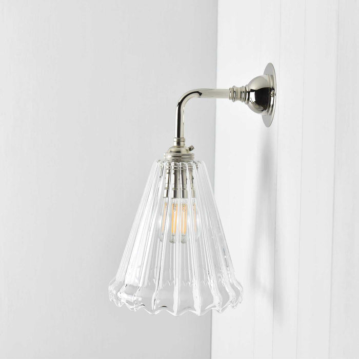 Rye Ribbed Glass small ribbed wall light with curved base and warm diffused glow