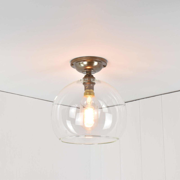 Soho medium clear glass flush ceiling light with minimalist globe design