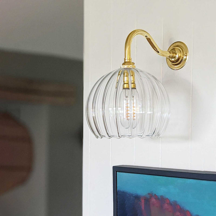 Soho Medium Ribbed Glass Shade wall light with swan neck and ribbed glass shade in antique brass finish