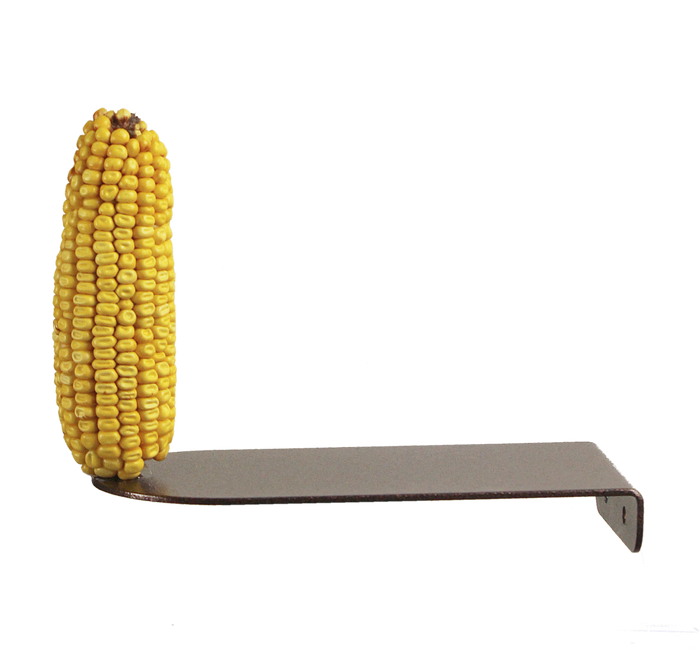 Side view of a powder-coated metal platform feeder mounted to a vertical surface with a corn cob placed on it.