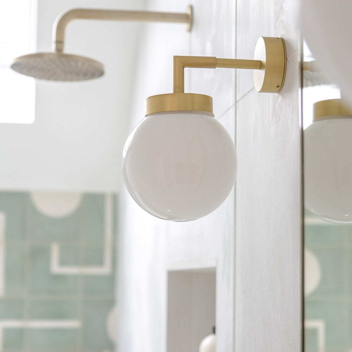 Jordan White Glass Bathroom Wall Light with sleek white globe and IP65 rating for bathroom use