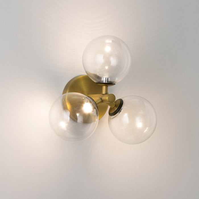 About Space Lighting Yosh Clear Glass on Tres Wall Brass